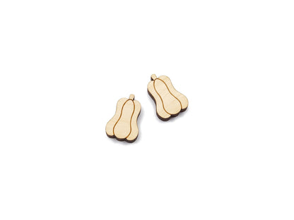 a pair of wooden cabochon stud earring blanks cut and engraved to look like gourds