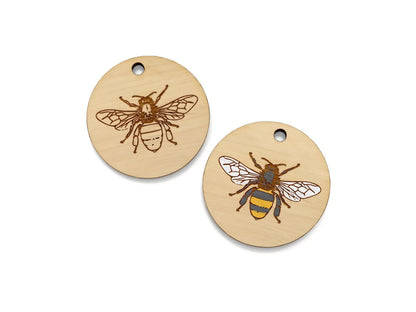 two wooden tags with a bee on them