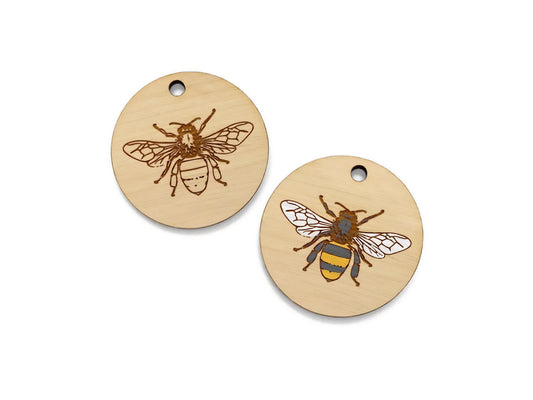 two wooden tags with a bee on them