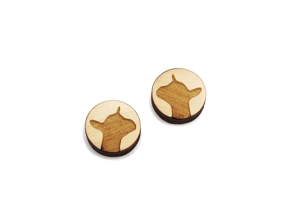 a pair of round wooden cabochon earring blanks engraved with a dairy goat silhouette