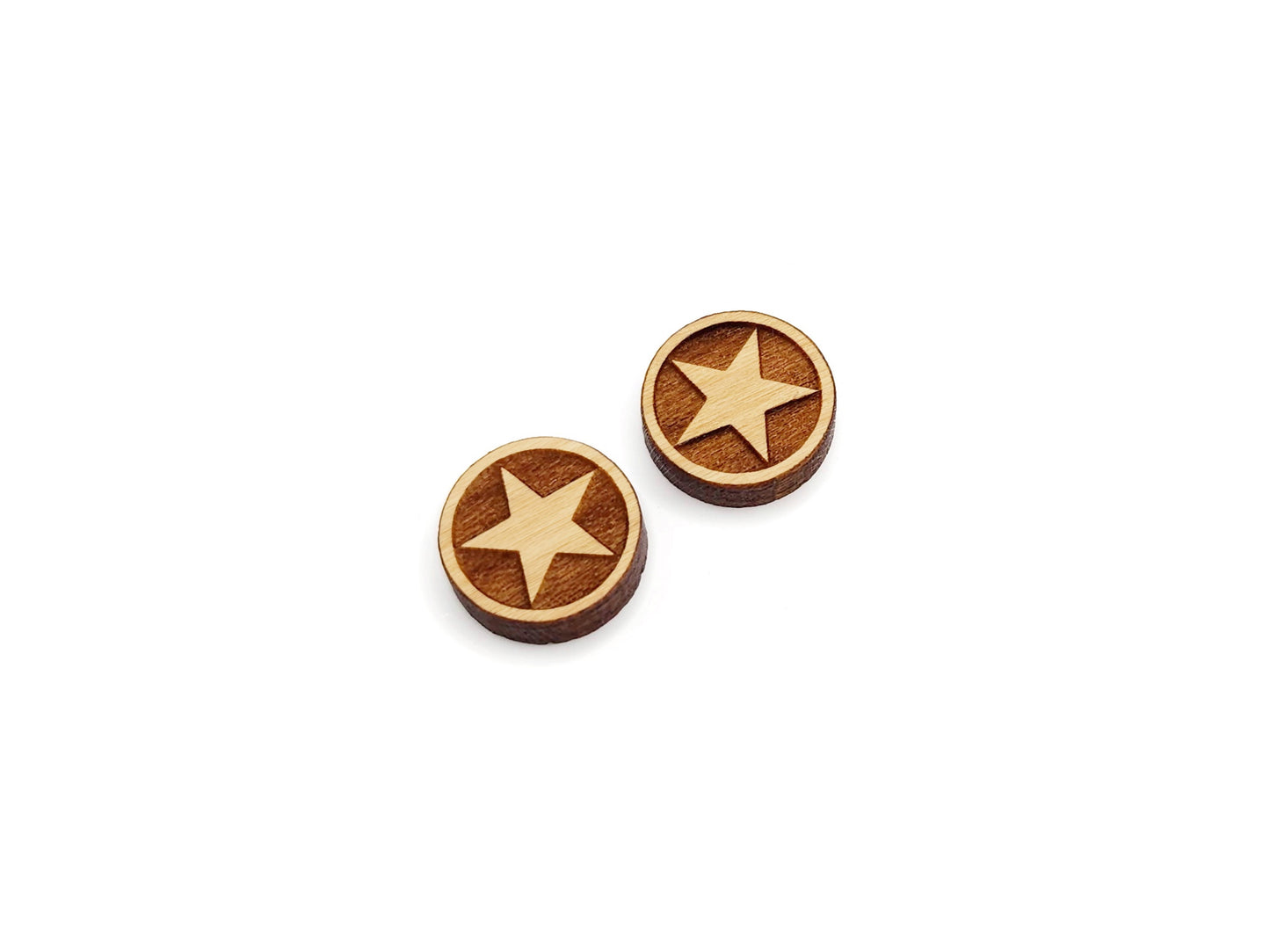 a pair of round wooden cabochon earring blanks engraved with a framed star