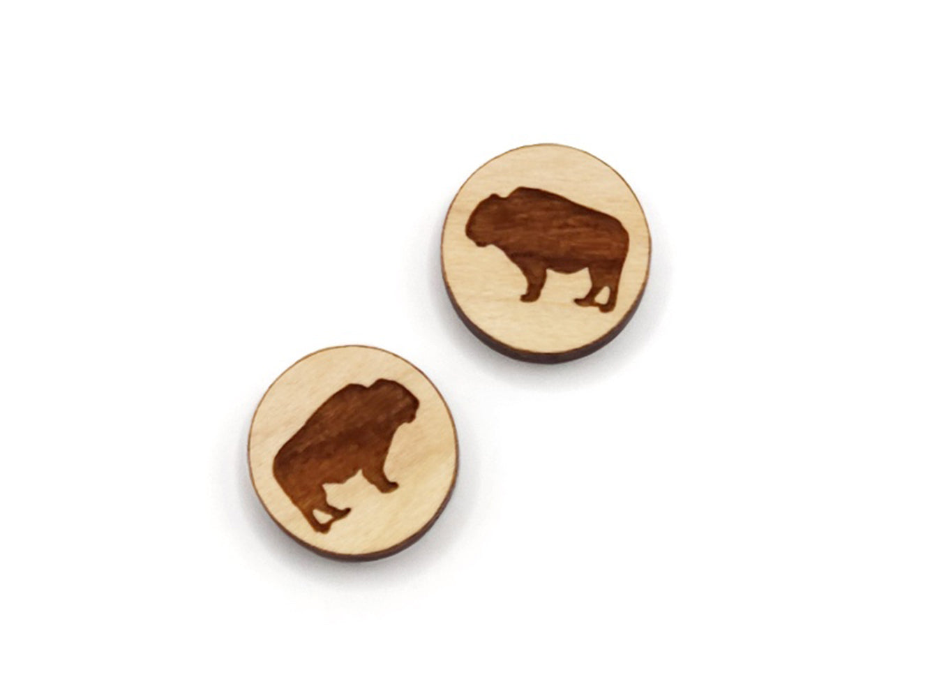 a pair of small round wooden cabochon blank for stud earrings engraved with a buffalo.