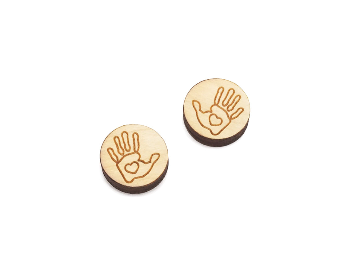 a pair of round wooden cabochon earring blanks engraved with a handprint outline with a heart