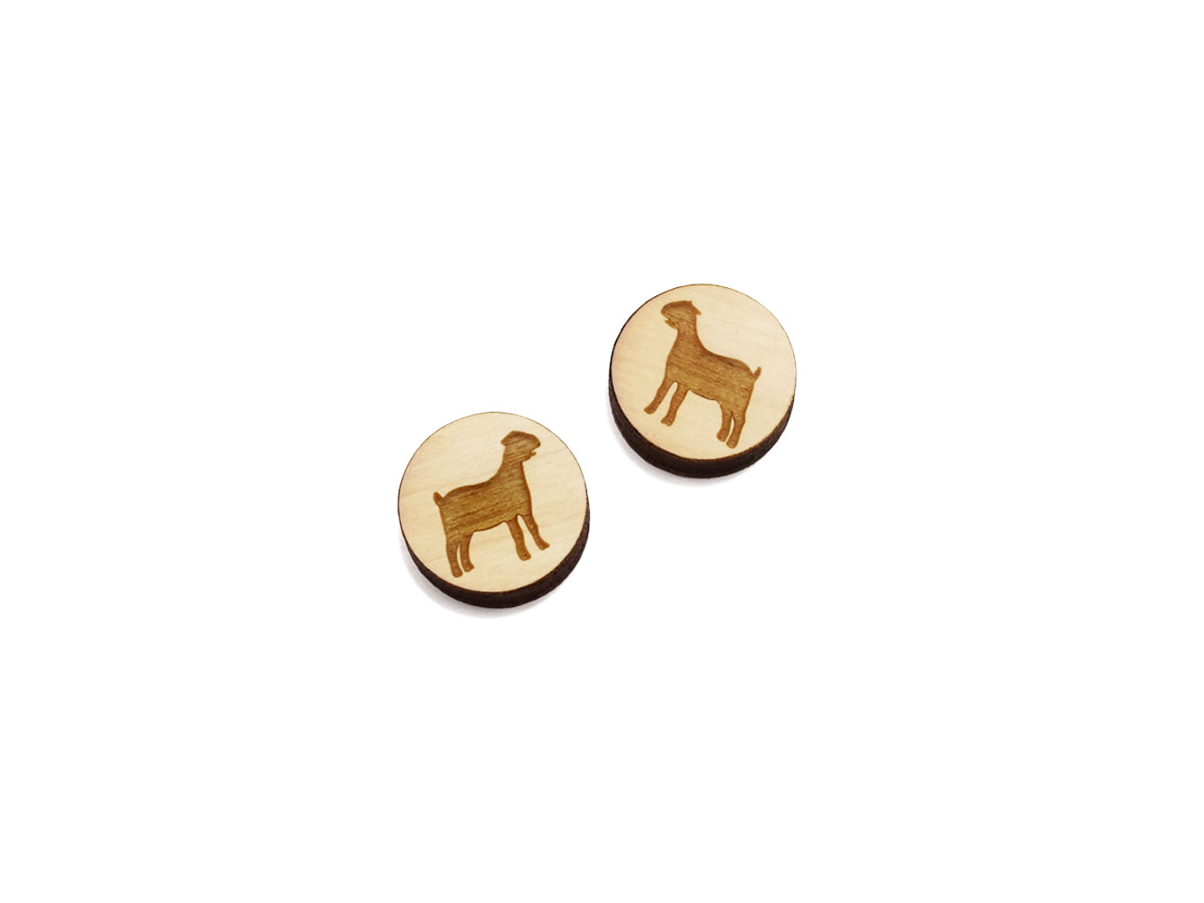 a pair of round wooden cabochon earring blanks engraved with a nubian goat silhouette