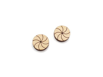 a pair of wooden cabochon stud earring blanks cut and engraved to look like peppermint candies