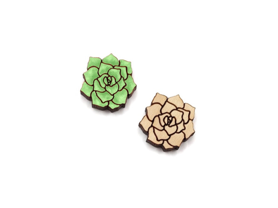 a pair of green and white flowers on a white background