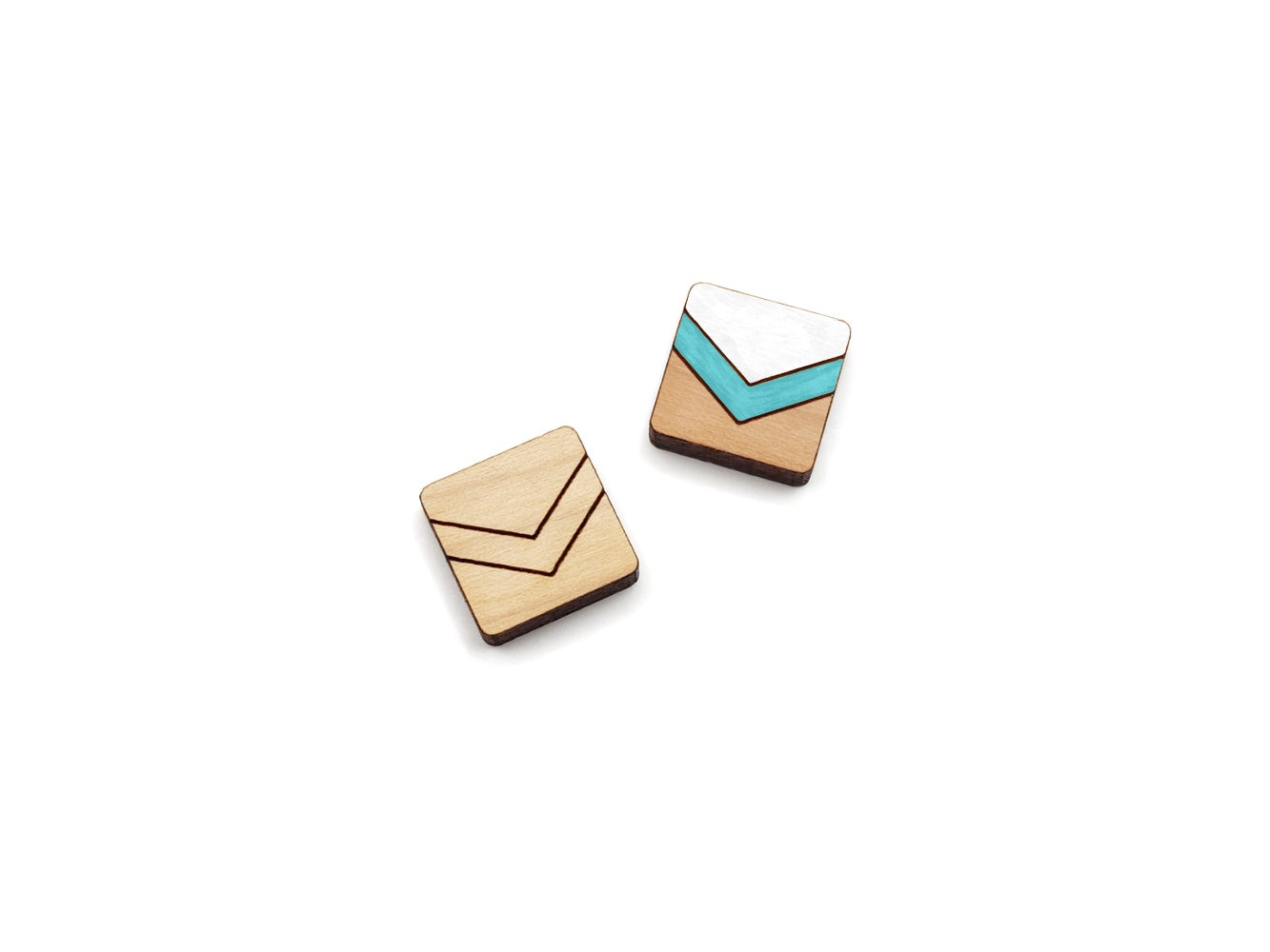 a pair of wooden cabochon stud earring blanks cut in a square shape and engraved with a chevron