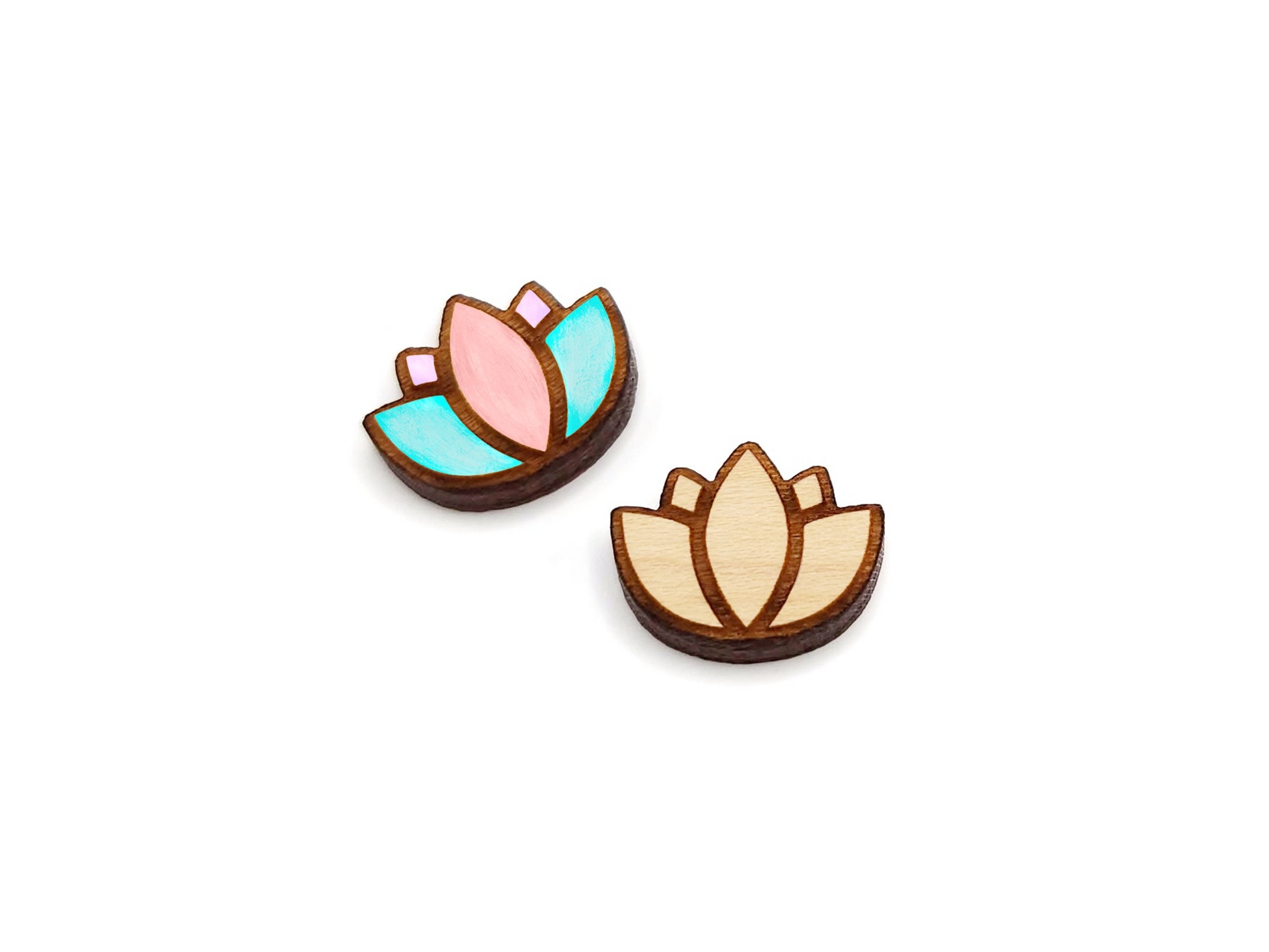 a pair of wooden cabochon earring blanks cut and engraved to look like a lotus flower