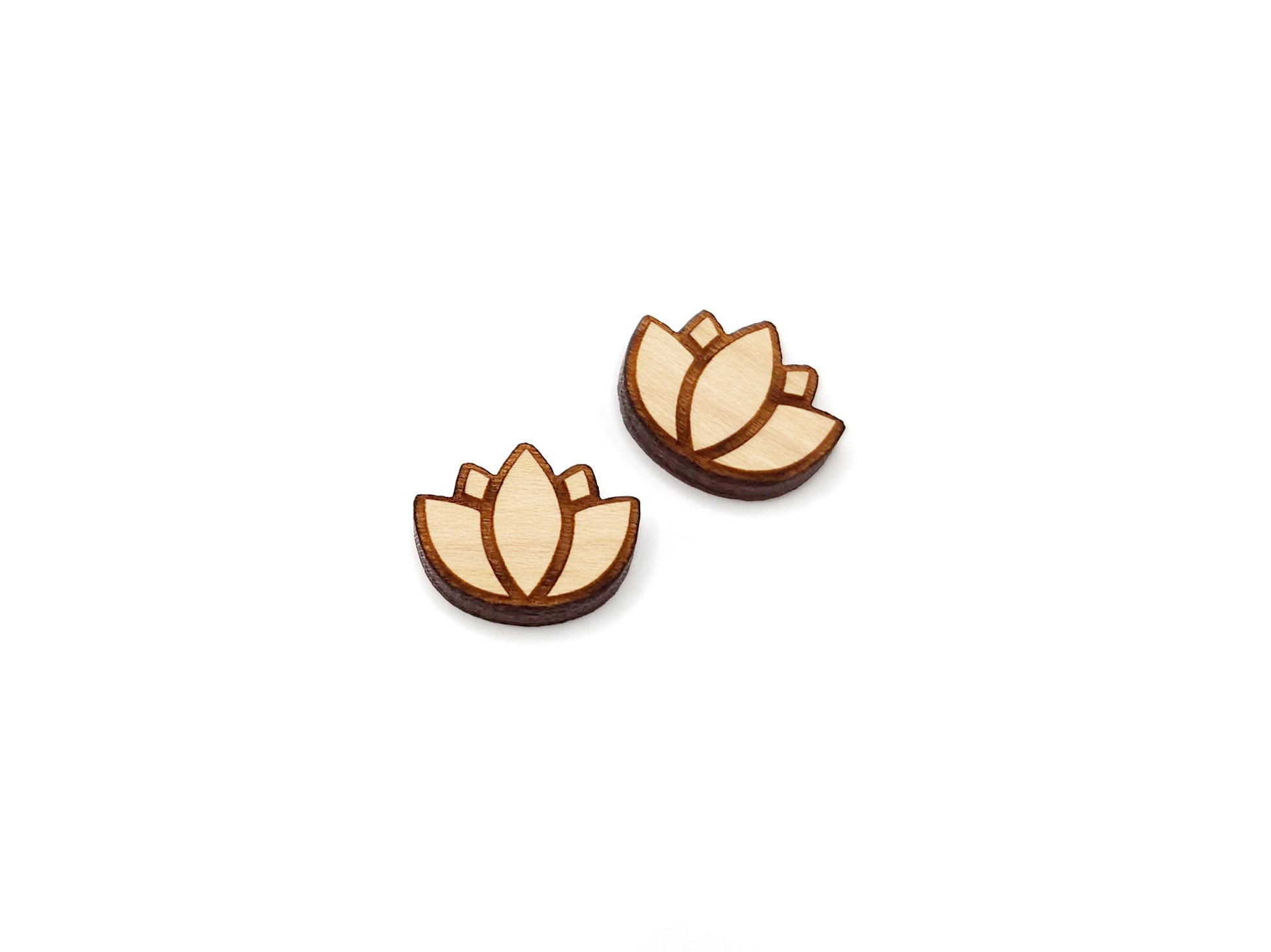a pair of wooden cabochon earring blanks cut and engraved to look like a lotus flower