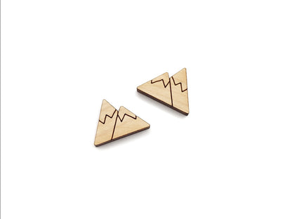 a pair of wooden cabochon stud earring blanks cut and engraved to look like snow-capped mountains