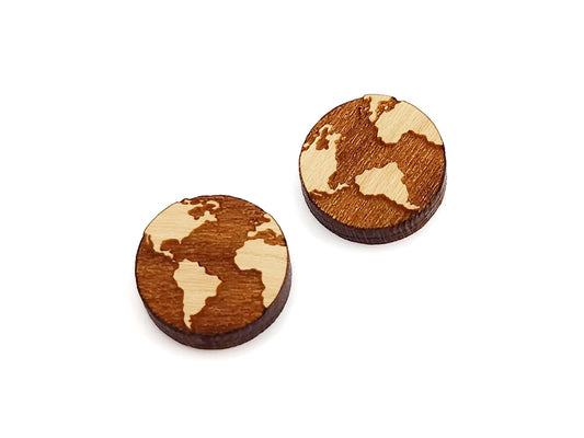 a pair of wooden earrings with a world map on it