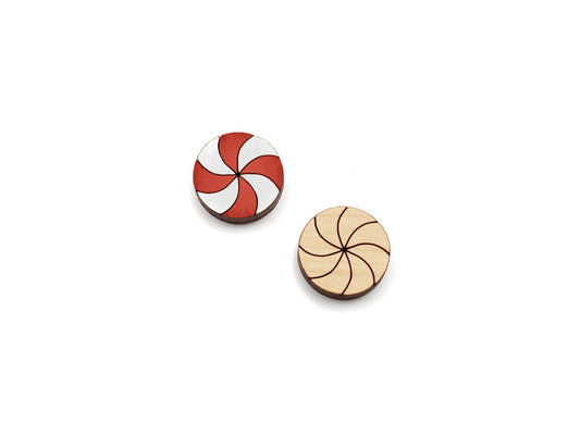 a pair of wooden cabochon stud earring blanks cut and engraved to look like peppermint candies