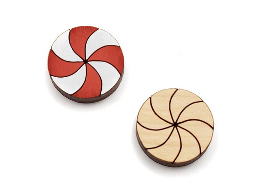 a pair of wooden cabochon stud earring blanks cut and engraved to look like peppermint candies