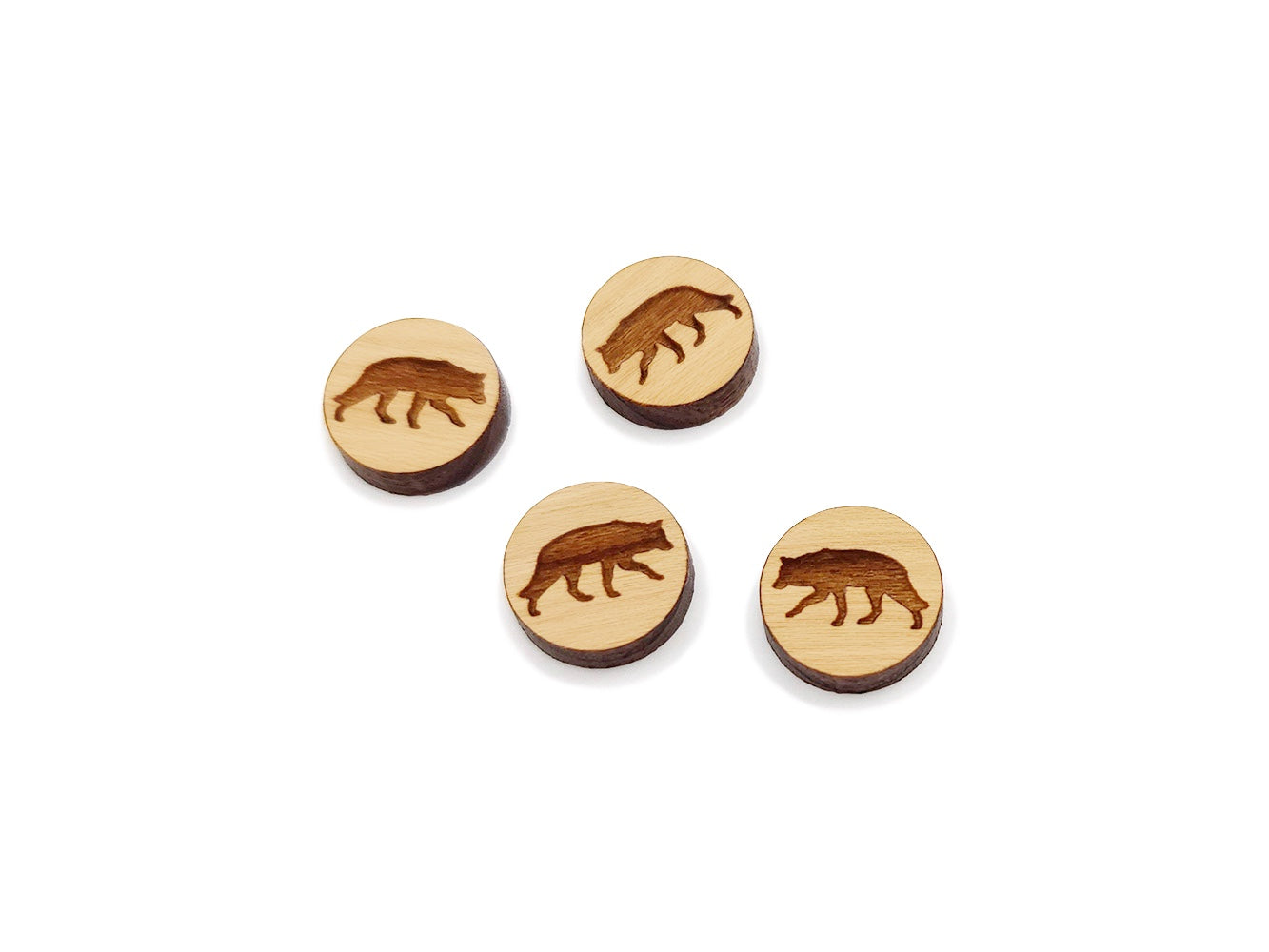 two pairs of round wooden cabochon earring blanks engraved with a wolf silhouette design