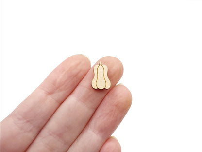 a person's hand holding a wooden cabochon stud earring blank cut and engraved to look like a gourd