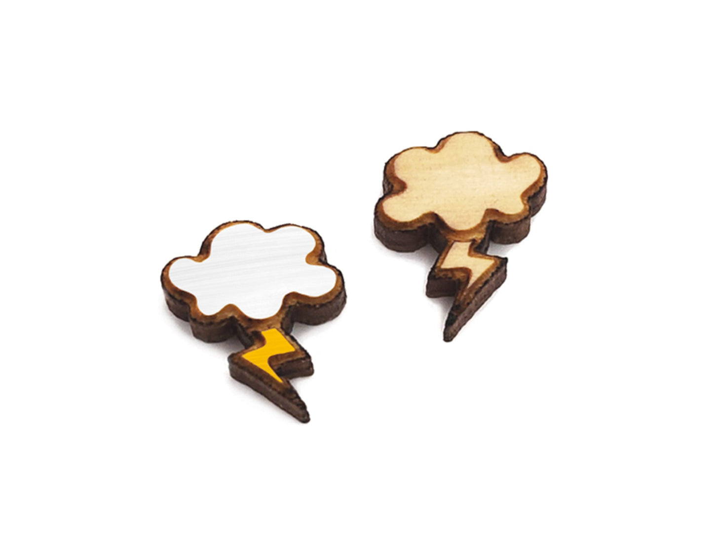 a pair of small wooden cabochon blanks for stud earrings, cut and engraved to look like clouds and lightning