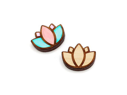 a pair of wooden cabochon earring blanks cut and engraved to look like a lotus flower