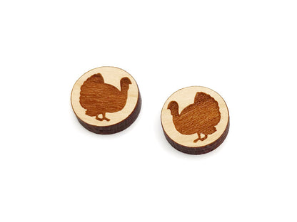 a pair of round wooden cabochon earring blanks engraved with a turkey silhouette