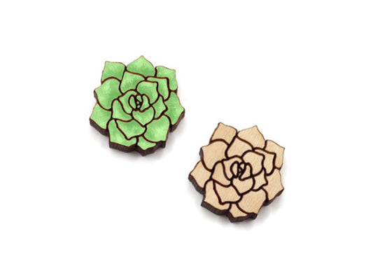 a pair of small wooden cabochon blanks cut and engraved to look like a succulent, one is hand painted