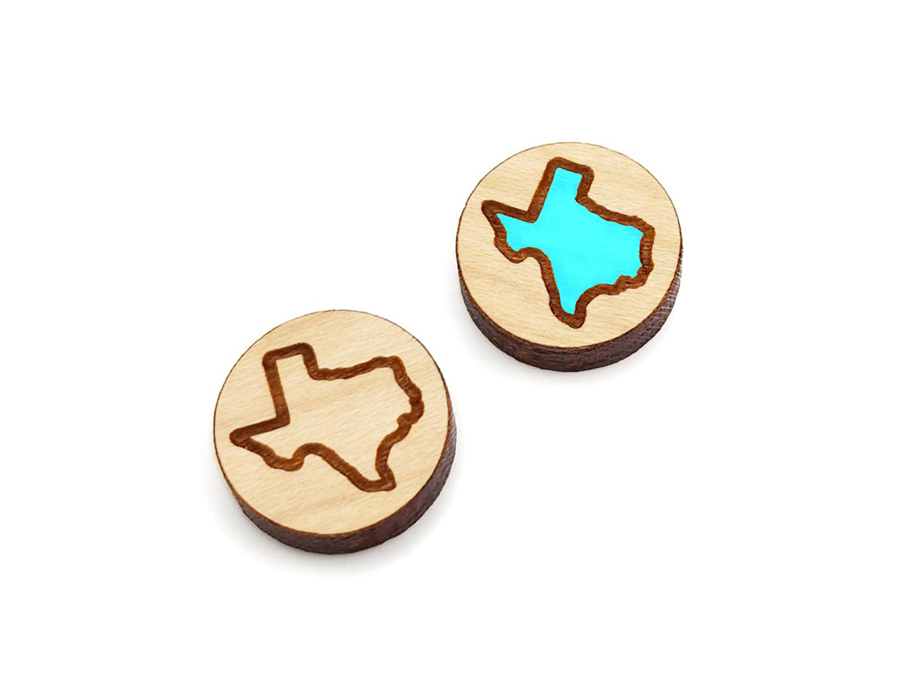 a pair of round wooden cabochon earring blanks engraved with the outline of Texas