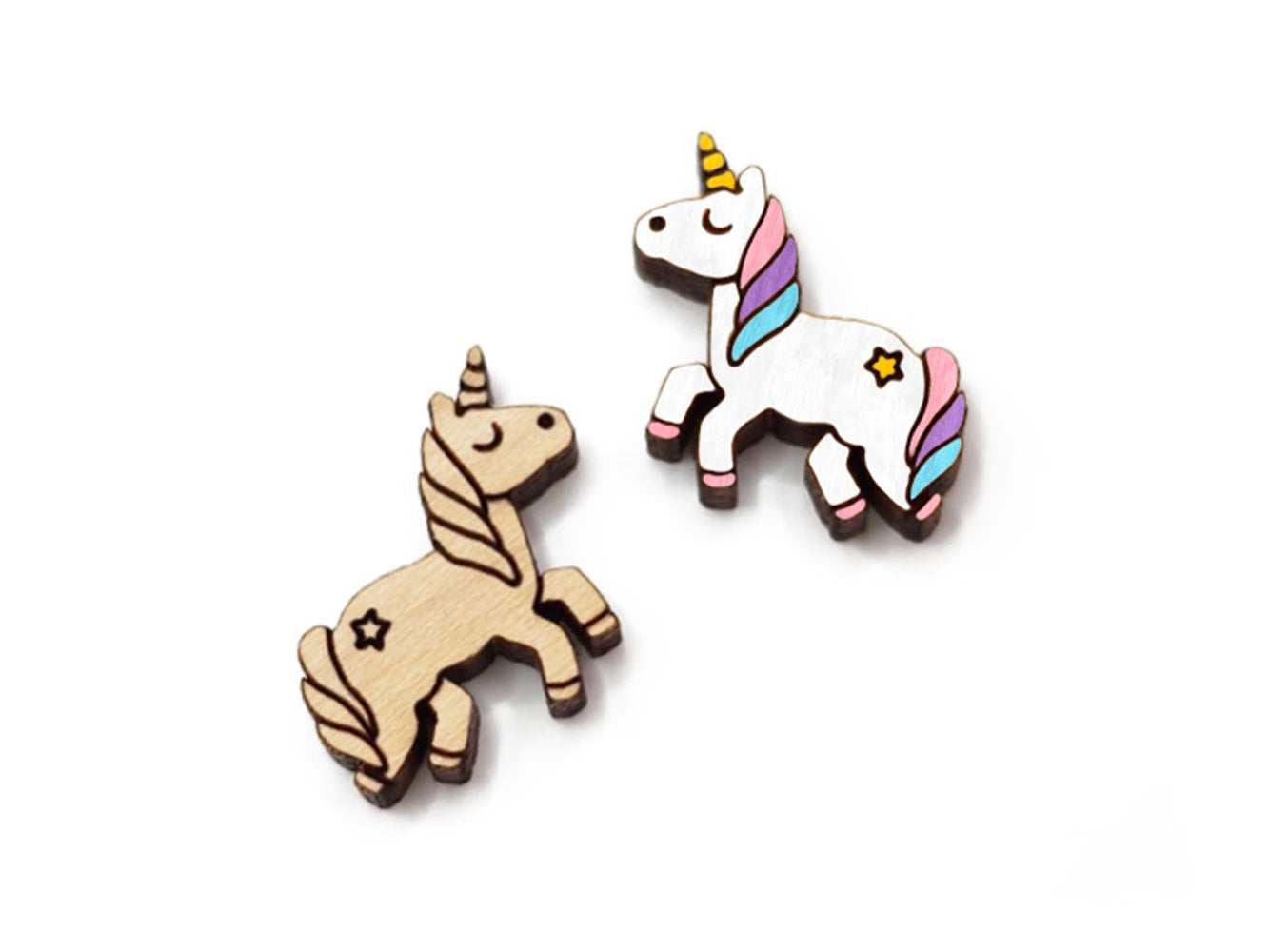 a pair of wooden cabochon stud earring blanks cut and engraved to look like a unicorn