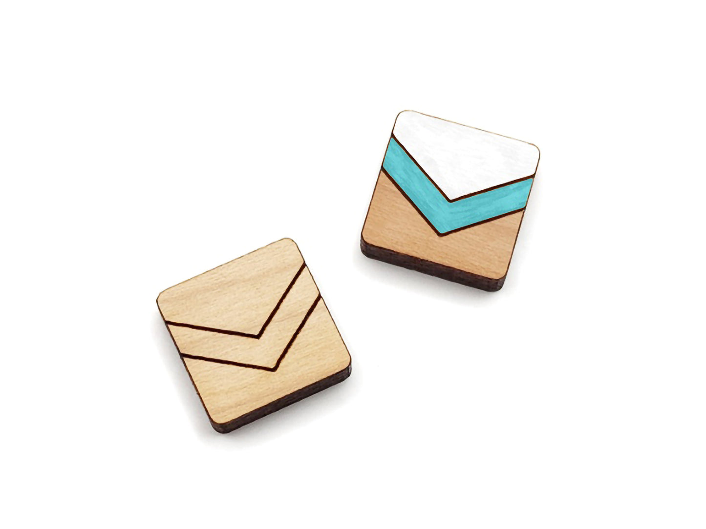 a pair of wooden cabochon stud earring blanks cut in a square shape and engraved with a chevron