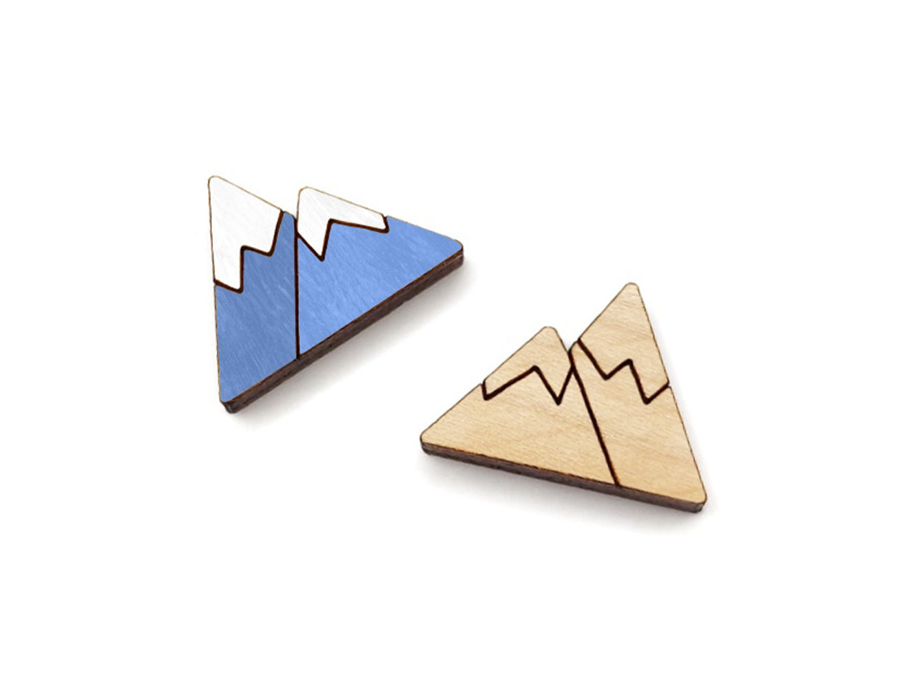 a pair of wooden cabochon stud earring blanks cut and engraved to look like snow-capped mountains