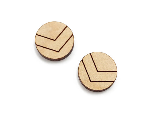 a pair of round wooden cabochon earring blanks engraved with chevron lines