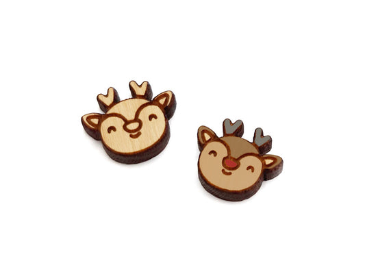 a pair of wooden cabochon stud earring blanks cut and engraved to look like a reindeer