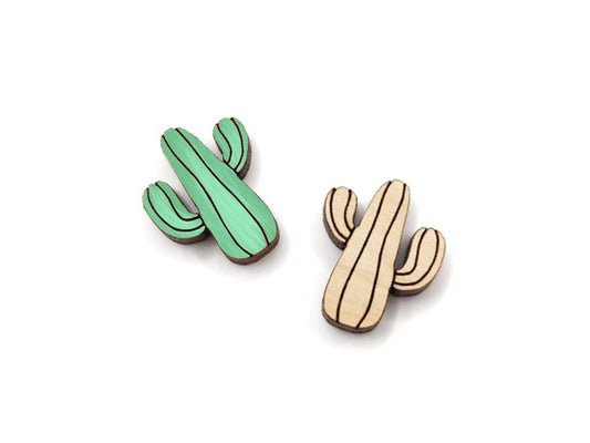 a pair of wooden cabochon stud earring blanks cut and engraved to look like a saguaro cactus