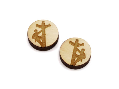 a pair of round wooden cabochon earring blanks engraved with a lineman