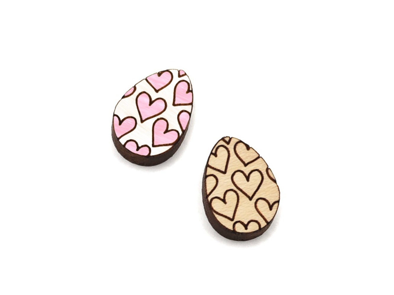 a pair of small wooden cabochon blanks for stud earrings, cut and engraved to look like Easter eggs with hearts