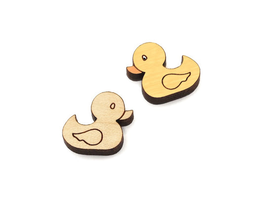 a pair of small wooden cabochon blanks for stud earrings, cut and engraved to look like rubber ducks