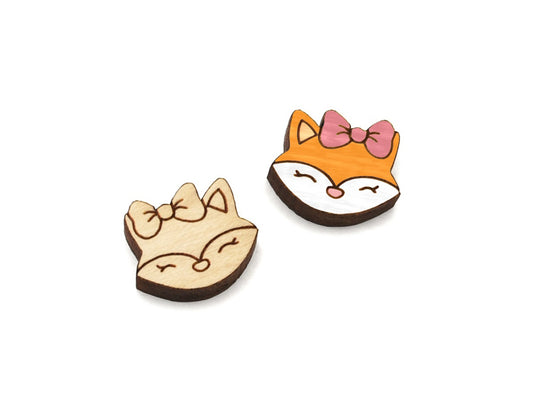 a pair of small wooden cabochon blanks for stud earrings, cut and engraved to look like a cute little fox wearing a bow