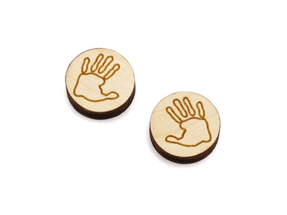 a pair of round wooden cabochon earring blanks engraved with a handprint outline