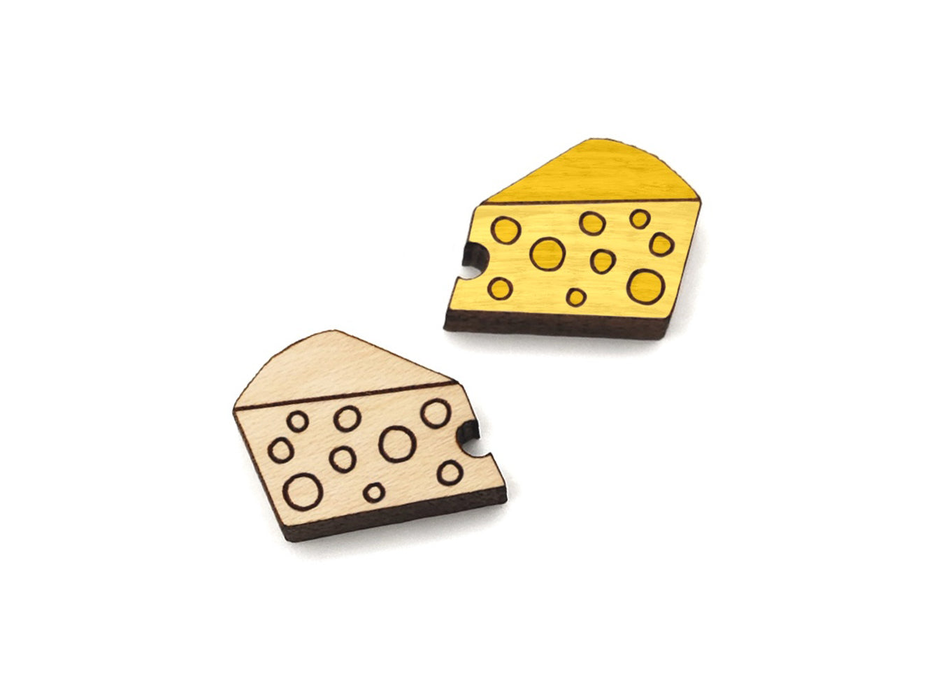 a pair of small wooden cabochon blanks for stud earrings, cut and engraved to look like a wedge of cheese