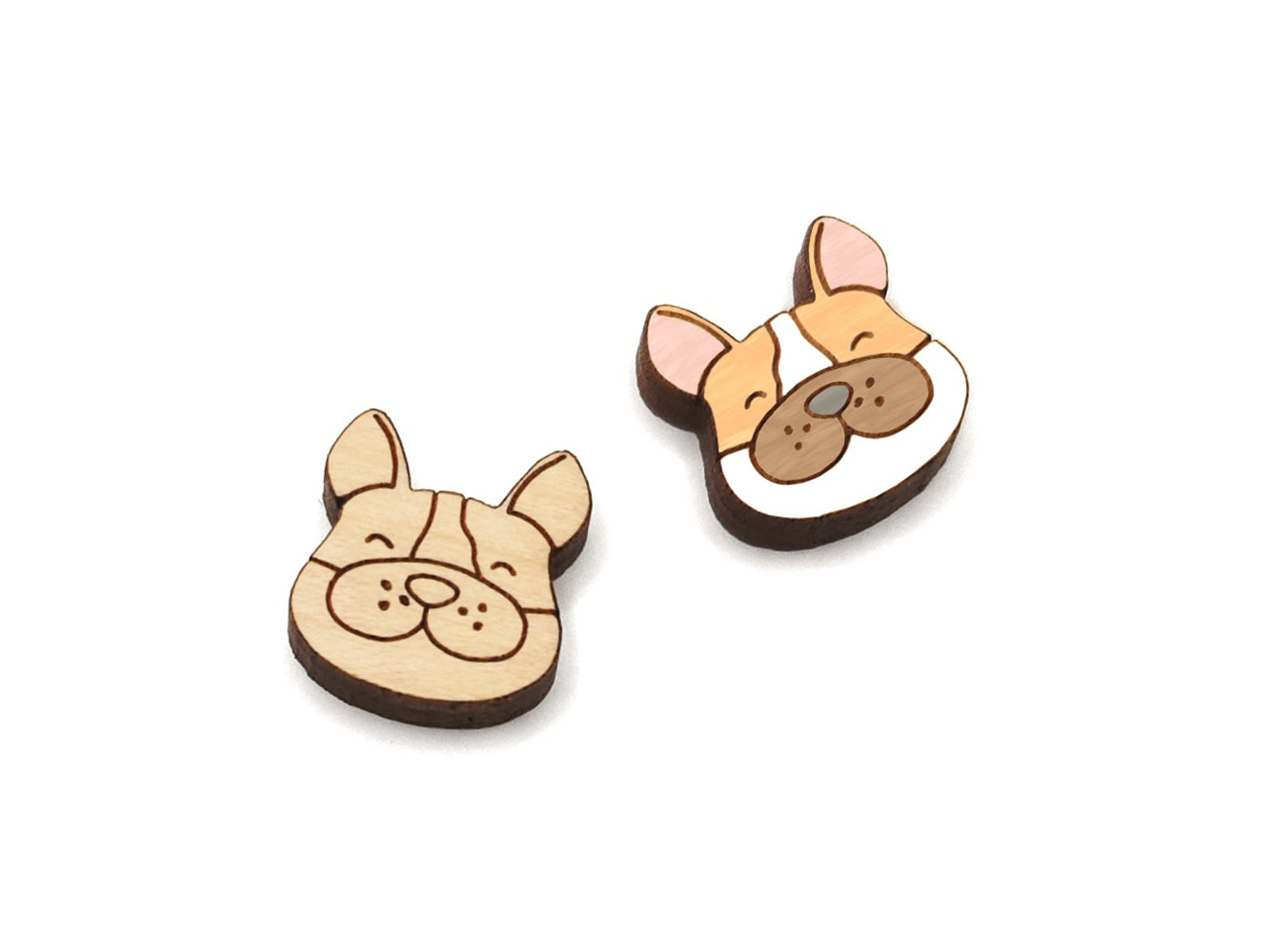 a pair of small wooden cabochon blanks for stud earrings, cut and engraved to look like a happy dog