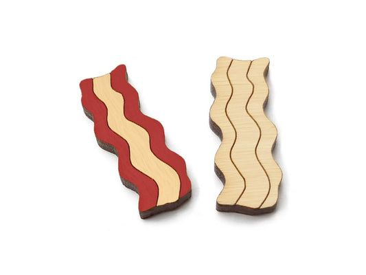 a pair of small wooden cabochon blanks for stud earrings, cut and engraved to look like slices of bacon