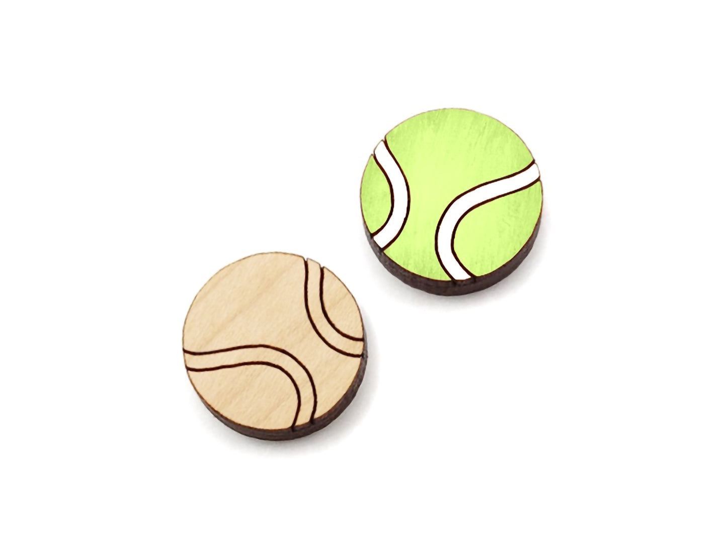 a pair of wooden cabochon stud earring blanks cut and engraved to look like tennis balls