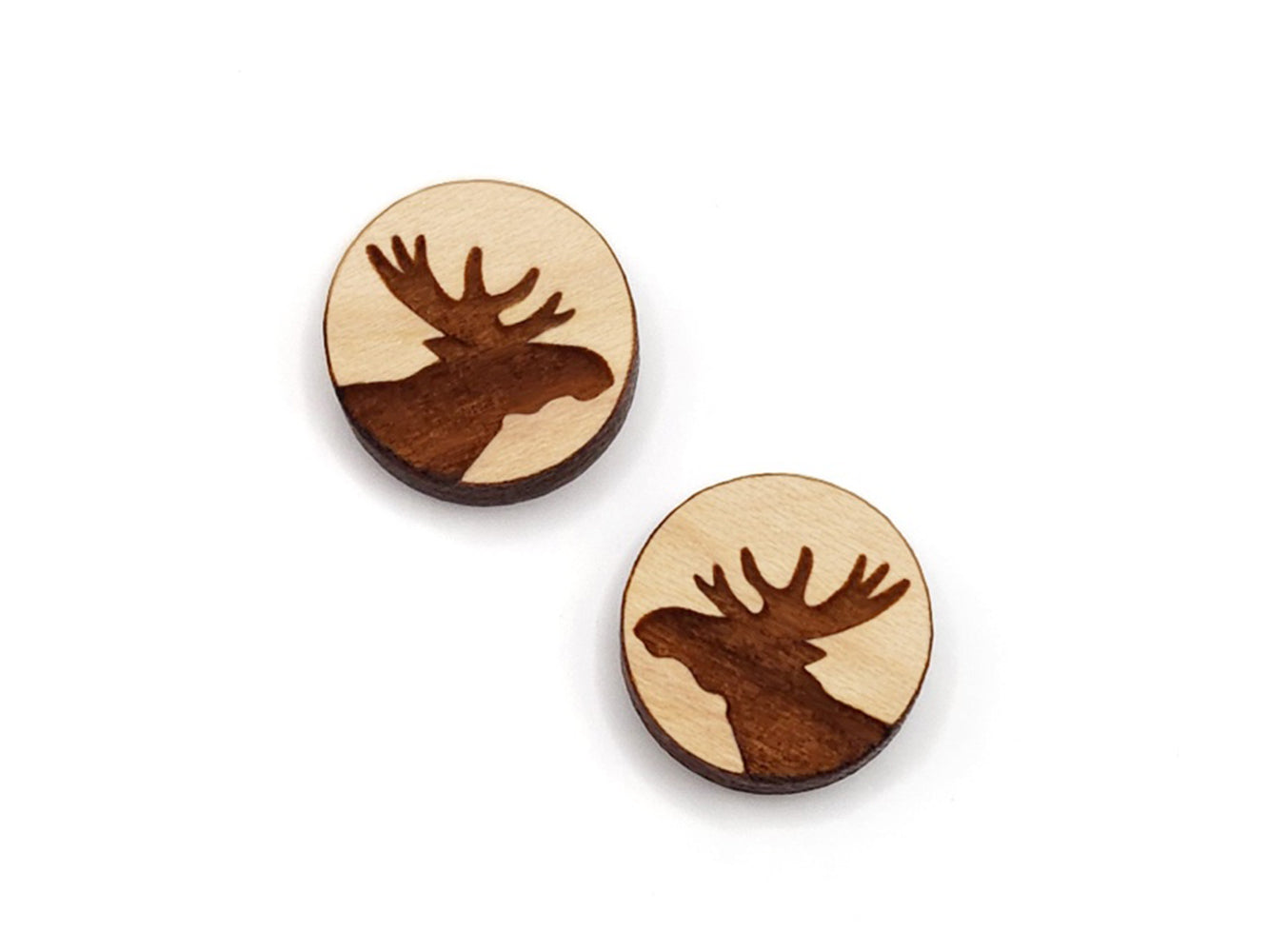 a pair of small round wooden cabochon blanks for stud earrings engraved with the silhouette of a 