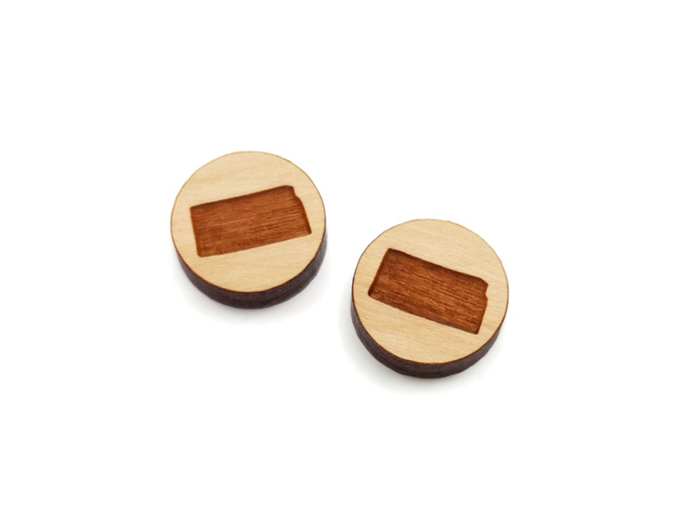 a pair of round wooden cabochon earring blanks engraved with the state of Kansas