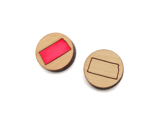 a pair of round wooden cabochon earring blanks engraved with the state of Kansas outline