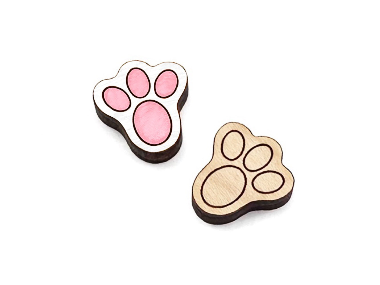 a pair of wooden cabochon stud earring blanks cut and engraved to look like bunny feet