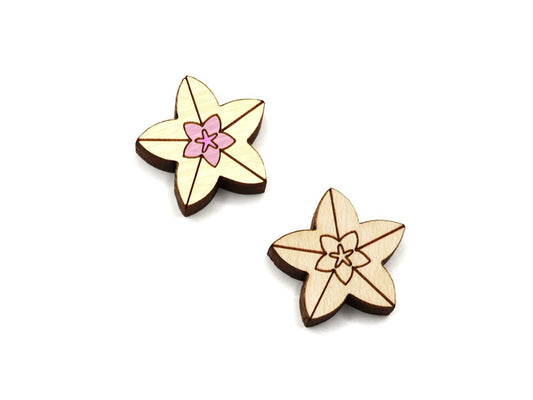 a pair of wooden flat-back cabochon blanks, engraved and cut to look like hoya flowers