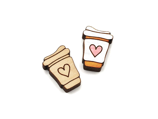 a pair of wooden flat-back cabochon blanks, engraved and cut to look like a to-go cup of coffee with a heart on it