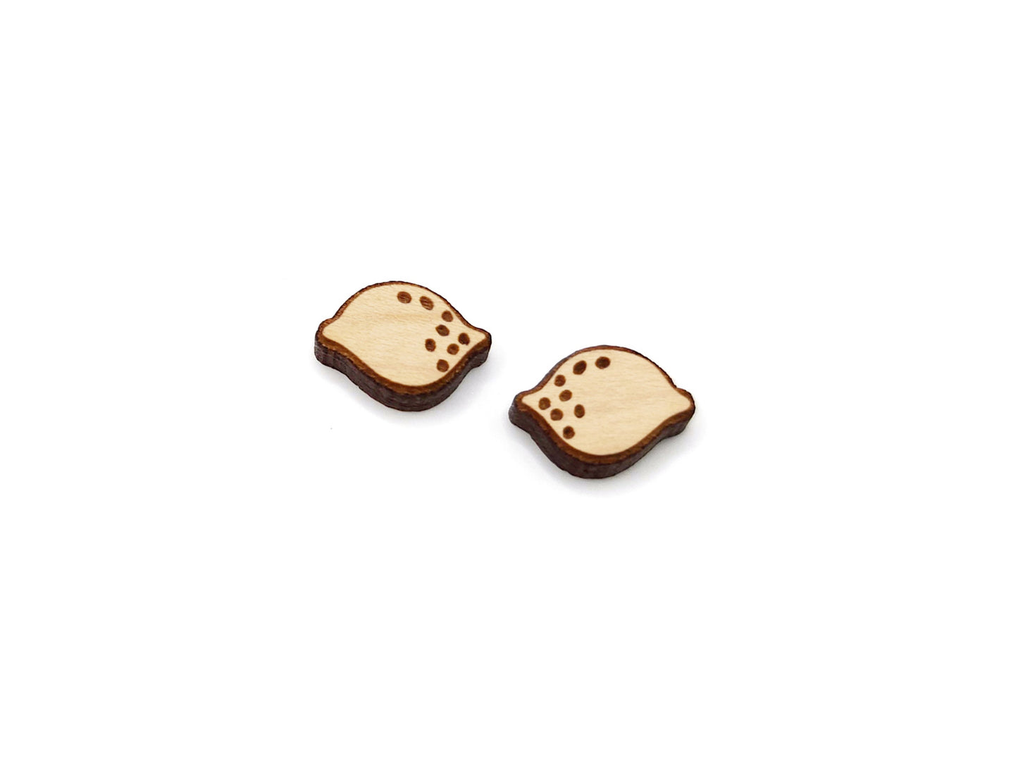 a pair of small wooden buttons with holes on them