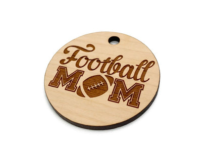 a wooden football mom ornament on a white background