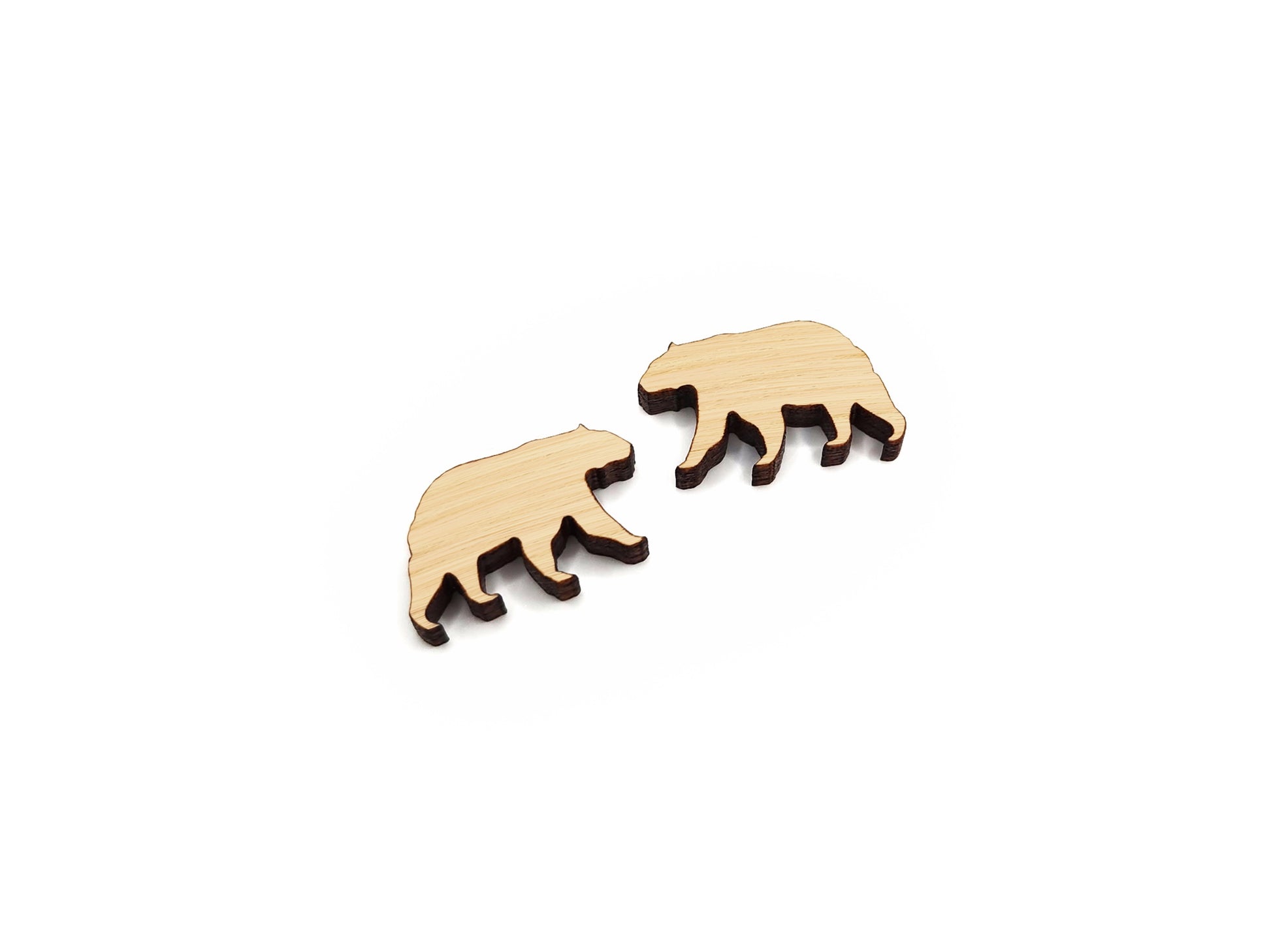 A pair of wood and acrylic cabochon earring blanks cut in the shape of a bear