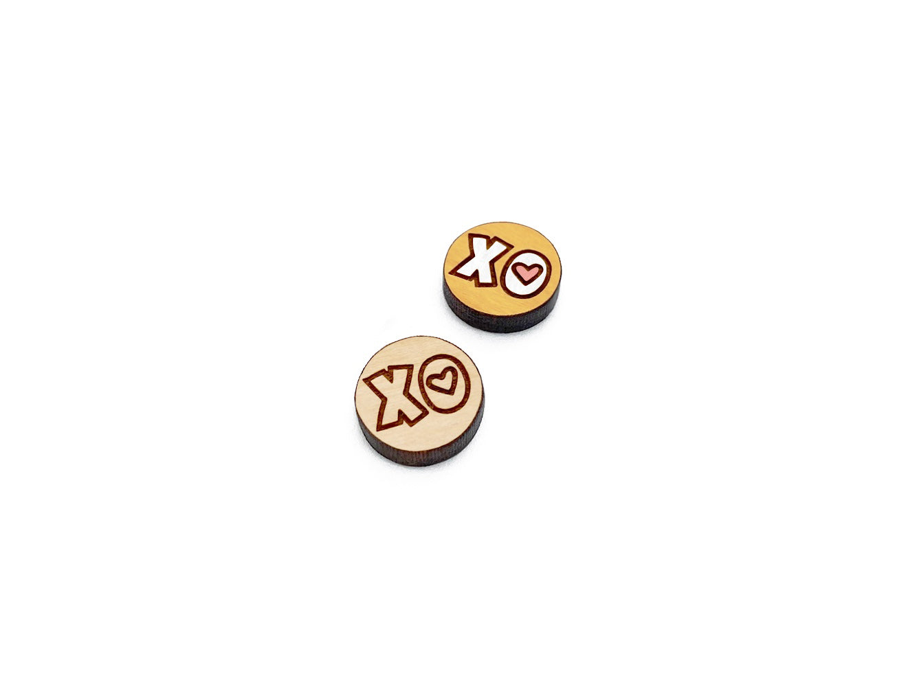 a pair of round wooden cabochon earring blanks engraved with an XO Heart design
