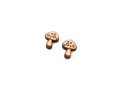 a pair of wooden mushrooms on a white background